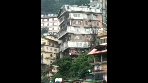 A screenshot from the video showing the collapse of residential building in India on September 30, 2021. - Sputnik International