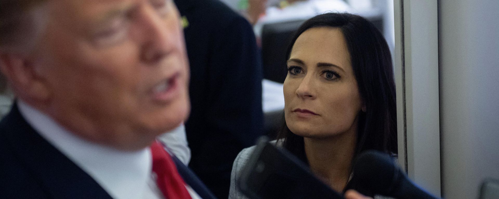 In this file photo former White House Press Secretary Stephanie Grisham listens as US President Donald Trump speaks to the media aboard Air Force One while flying between El Paso, Texas and Joint Base Andrews in Maryland, August 7, 2019. - An aide dubbed the Music Man was tasked with playing calming tunes for Donald Trump when he went into rages, according to a scandal-filled book by a former press secretary.Stephanie Grisham, notorious for not giving a single televised press conference while serving as Trump's chief spokeswoman, writes in I'll Take Your Questions Now that her boss went into terrifying rants.The former president and his wife Melania have vociferously condemned the book, excerpts of which appeared on September 28, 2021 in The New York Times and Washington Post. In this file photo former White House Press Secretary Stephanie Grisham listens as US President Donald Trump speaks to the media aboard Air Force One while flying between El Paso, Texas and Joint Base Andrews in Maryland, August 7, 2019. - An aide dubbed the Music Man was tasked with playing calming tunes for Donald Trump when he went into rages, according to a scandal-filled book by a former press secretary.Stephanie Grisham, notorious for not giving a single televised press conference while serving as Trump's chief spokeswoman, writes in I'll Take Your Questions Now that her boss went into terrifying rants.The former president and his wife Melania have vociferously condemned the book, excerpts of which appeared on September 28, 2021 in The New York Times and Washington Post. - Sputnik International, 1920, 04.10.2021