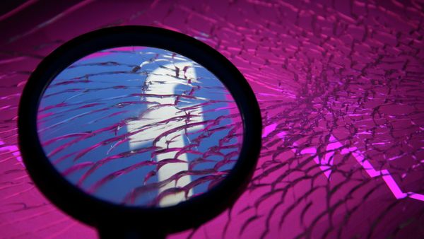 Facebook logo and stock graph are displayed through broken glass in this illustration taken October 4, 2021. REUTERS/Dado Ruvic - Sputnik International