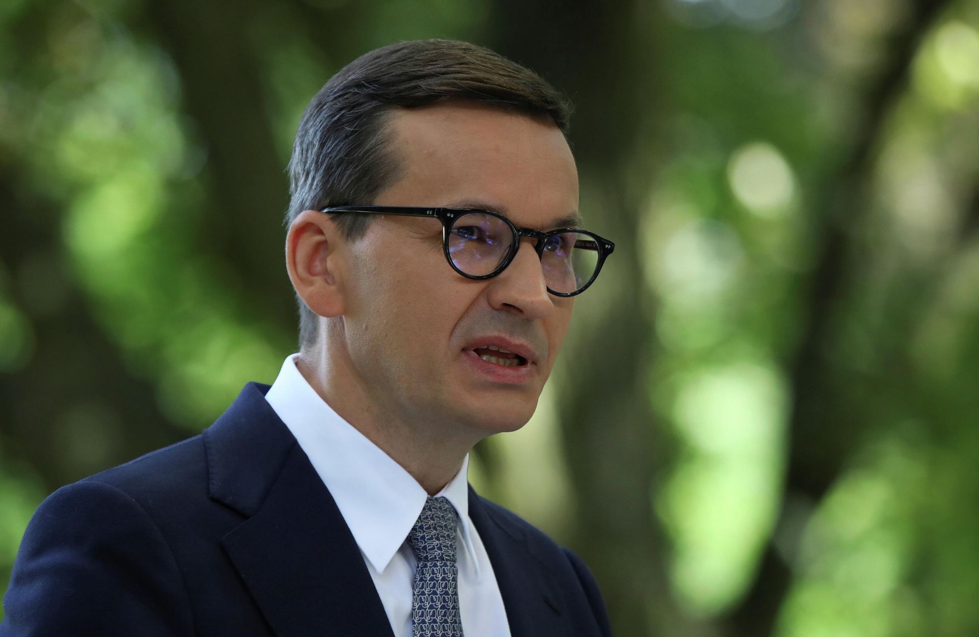 Polish Prime Minister Mateusz Morawiecki speaks during news conference with German Chancellor Angela Merkel after their meeting in Royal Lazienki Park in Warsaw, Poland, September 11, 2021 - Sputnik International, 1920, 19.10.2021
