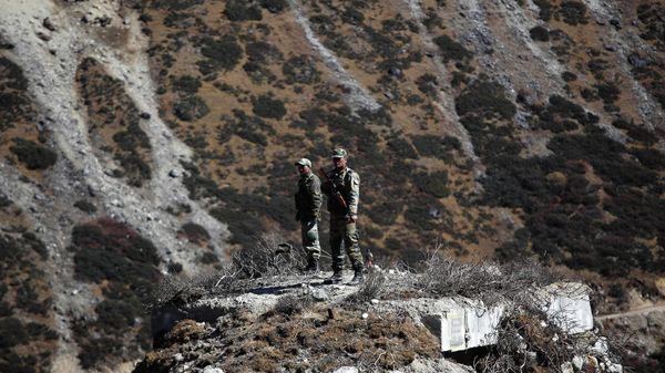 Indian army soldiers keep watch on a bunker at the Indo China border in Bumla at an altitude of 15,700 feet (4,700 meters) above sea level in Arunachal Pradesh, India, Sunday, Oct. 21, 2012 - Sputnik International