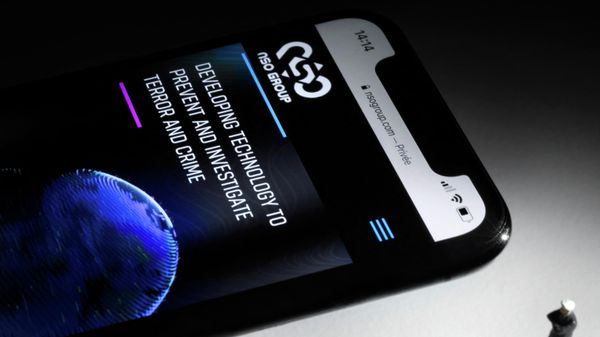 This studio photographic illustration shows a smartphone with the website of Israel's NSO Group which features 'Pegasus' spyware, on display in Paris on July 21, 2021.  - Sputnik International