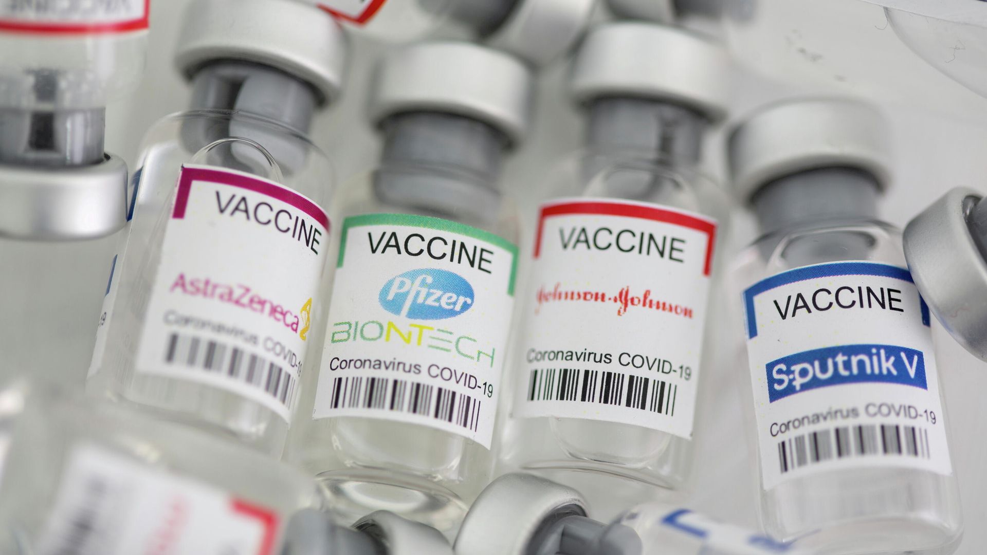 Vials labelled AstraZeneca, Pfizer - Biontech, Johnson&Johnson, Sputnik V coronavirus disease (COVID-19) vaccine are seen in this illustration picture taken May 2, 2021. - Sputnik International, 1920, 10.10.2021