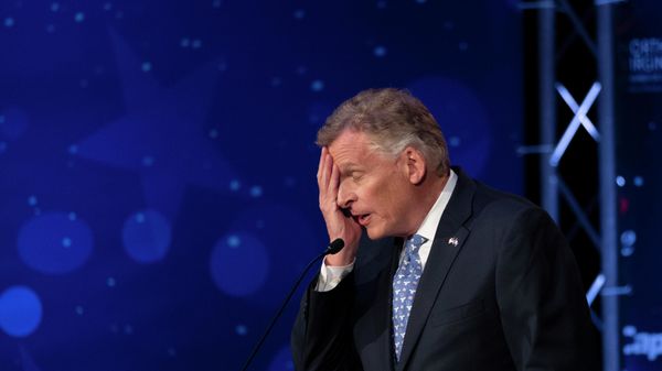 Virginia Democratic gubernatorial candidate and former Gov. Terry McAuliffe participates with his Republican challenger, Glenn Youngkin, in a debate at Northern Virginia Community College, in Alexandria, Va., Tuesday, Sept. 28, 2021. - Sputnik International