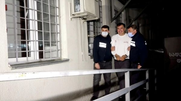Georgia's former President Mikheil Saakashvili, who was detained after returning to the country, is escorted by police officers as he arrives at a prison in Rustavi, Georgia October 1, 2021, in this still image taken from video. - Sputnik International