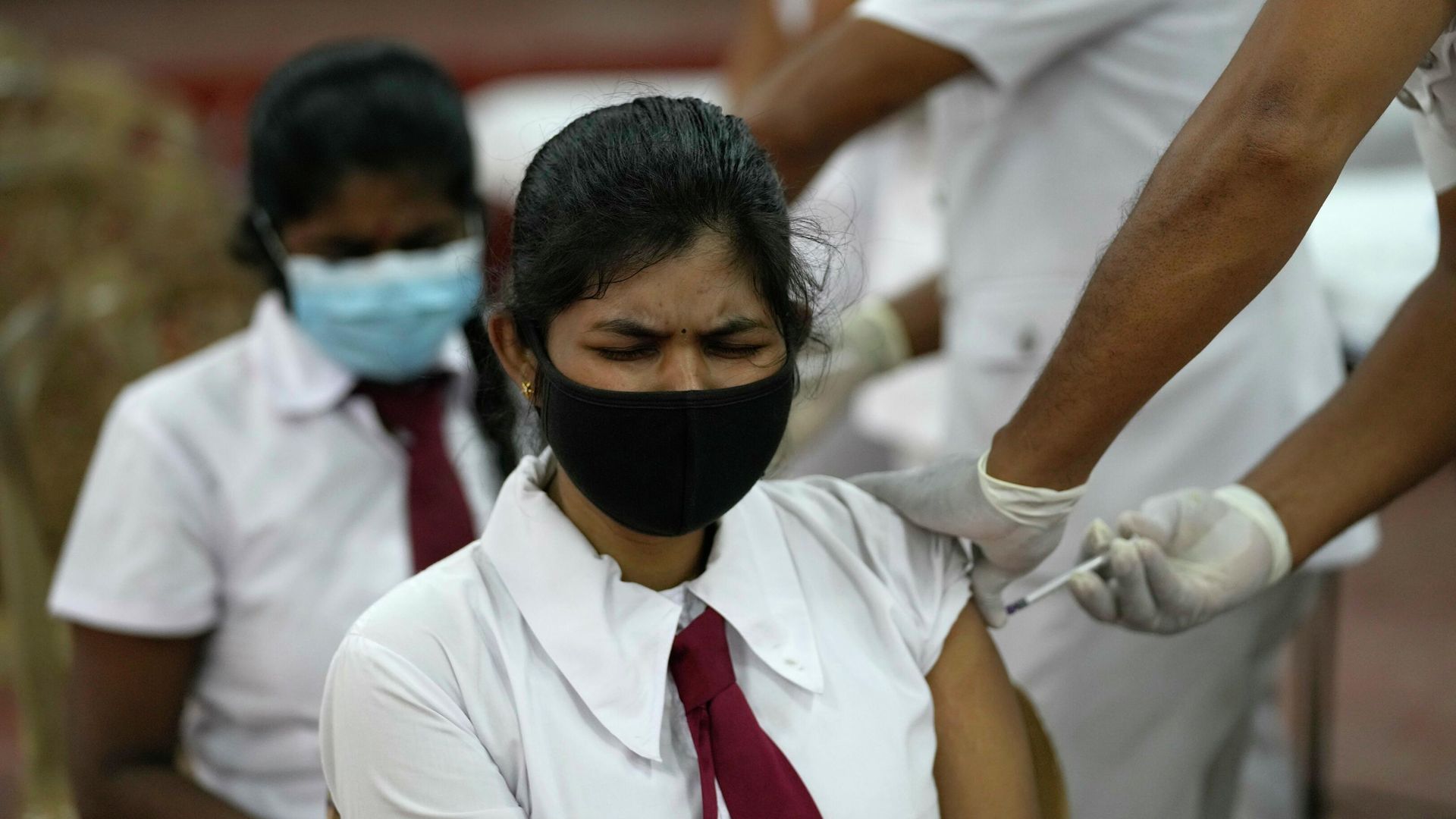 A Sri Lankan school student receives a COVID-19 vaccine in Colombo, Sri Lanka, Friday, Oct. 15, 2021. Sri Lanka is vaccinating 18- and 19-year-olds against the coronavirus as it expands the shots to students. After beginning with older people, Sri Lanka has now vaccinated 57% of its 22 million population. A Sri Lankan school student receives a COVID-19 vaccine in Colombo, Sri Lanka, Friday, Oct. 15, 2021. Sri Lanka is vaccinating 18- and 19-year-olds against the coronavirus as it expands the shots to students. After beginning with older people, Sri Lanka has now vaccinated 57% of its 22 million population. - Sputnik International, 1920, 15.10.2021