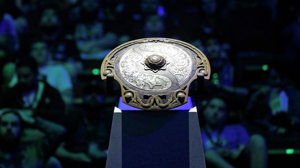 The championship trophy for the International Dota 2 Championships sits illuminated in the arena, Wednesday, Aug. 9, 2017, in Seattle. Members of the five-person eSport teams each select fantasy-world hero characters and the teams then face off for control of the game world's map. The championship, pitting 16 teams against each other for $24 million in prize money, runs through Saturday. (AP Photo/Elaine Thompson) - Sputnik International