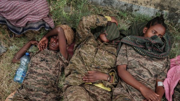 Captive Ethiopian female soldiers lie on the grass at Mekelle Rehabilitation Center in Mekele, the capital of Tigray region, Ethiopia, on July 2, 2021 - Sputnik International