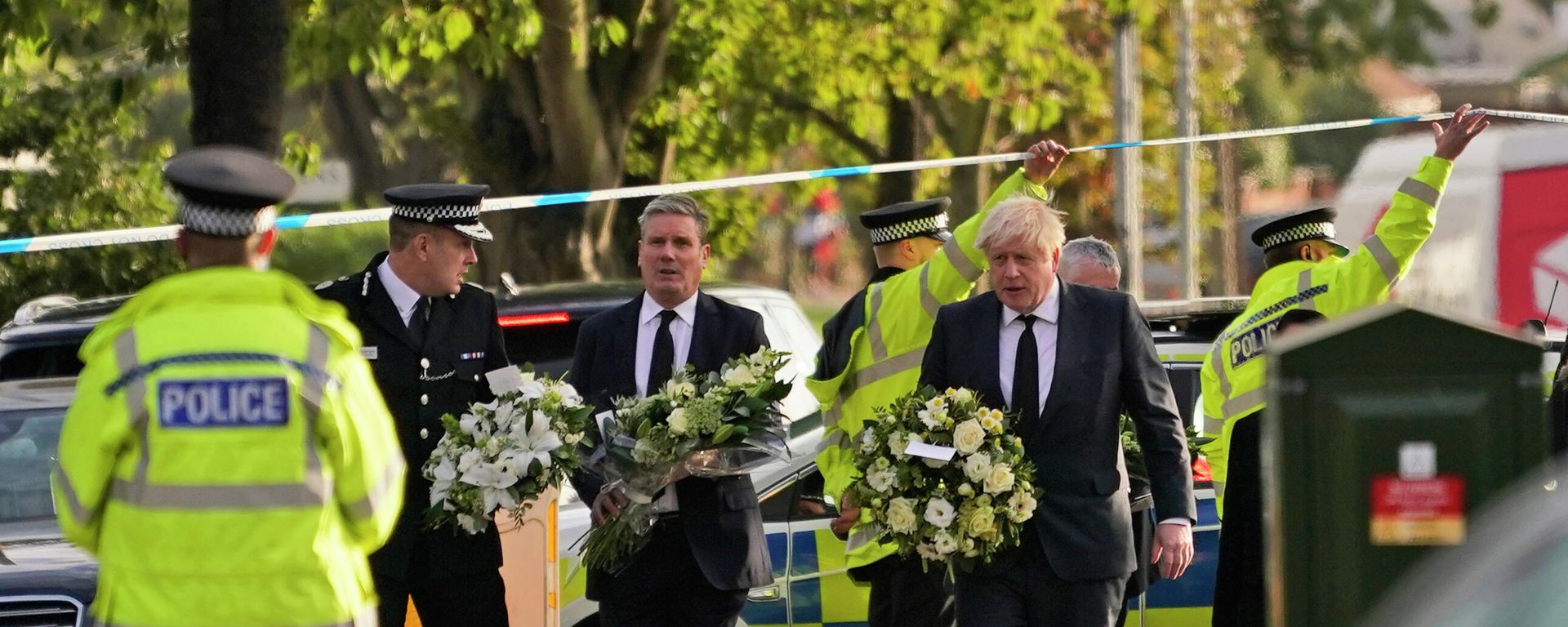 British Prime Minister Boris Johnson, right, and Leader of the Labour Party Sir Keir Starmer, second from right, carry flowers as they arrive at the scene where a member of Parliament was stabbed Friday, in Leigh-on-Sea, Essex, England, Saturday, Oct. 16, 2021 British Prime Minister Boris Johnson, right, and Leader of the Labour Party Sir Keir Starmer, second from right, carry flowers as they arrive at the scene where a member of Parliament was stabbed Friday, in Leigh-on-Sea, Essex, England, Saturday, Oct. 16, 2021 - Sputnik International, 1920, 18.10.2021