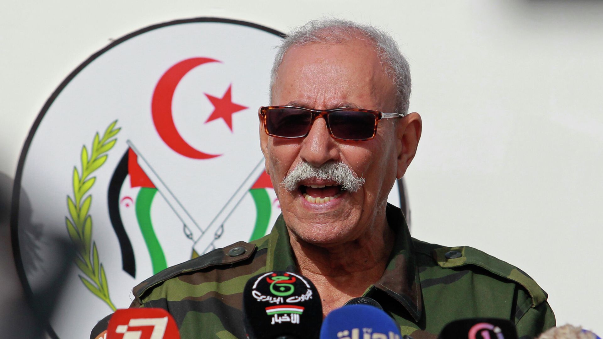 In this Feb. 27, 2021 file photo, Brahim Ghali, leader of the Polisario front, delivers a speech in a refugee camp near Tindouf, southern Algeria. Brahim Ghali, the leader of the Western Sahara independence movement at the heart of a diplomatic spat between Spain and Morocco, will appear before an investigating judge in Spain on June 1, 2021. Ghali, who has been recovering from COVID-19 in a Spanish hospital, faces a probe for possible genocide and a lawsuit for alleged tortures. In this Feb. 27, 2021 file photo, Brahim Ghali, leader of the Polisario front, delivers a speech in a refugee camp near Tindouf, southern Algeria. Brahim Ghali, the leader of the Western Sahara independence movement at the heart of a diplomatic spat between Spain and Morocco, will appear before an investigating judge in Spain on June 1, 2021. Ghali, who has been recovering from COVID-19 in a Spanish hospital, faces a probe for possible genocide and a lawsuit for alleged tortures. - Sputnik International, 1920, 23.01.2023