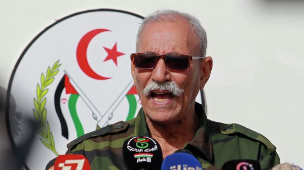 In this Feb. 27, 2021 file photo, Brahim Ghali, leader of the Polisario front, delivers a speech in a refugee camp near Tindouf, southern Algeria. Brahim Ghali, the leader of the Western Sahara independence movement at the heart of a diplomatic spat between Spain and Morocco, will appear before an investigating judge in Spain on June 1, 2021. Ghali, who has been recovering from COVID-19 in a Spanish hospital, faces a probe for possible genocide and a lawsuit for alleged tortures. - Sputnik International
