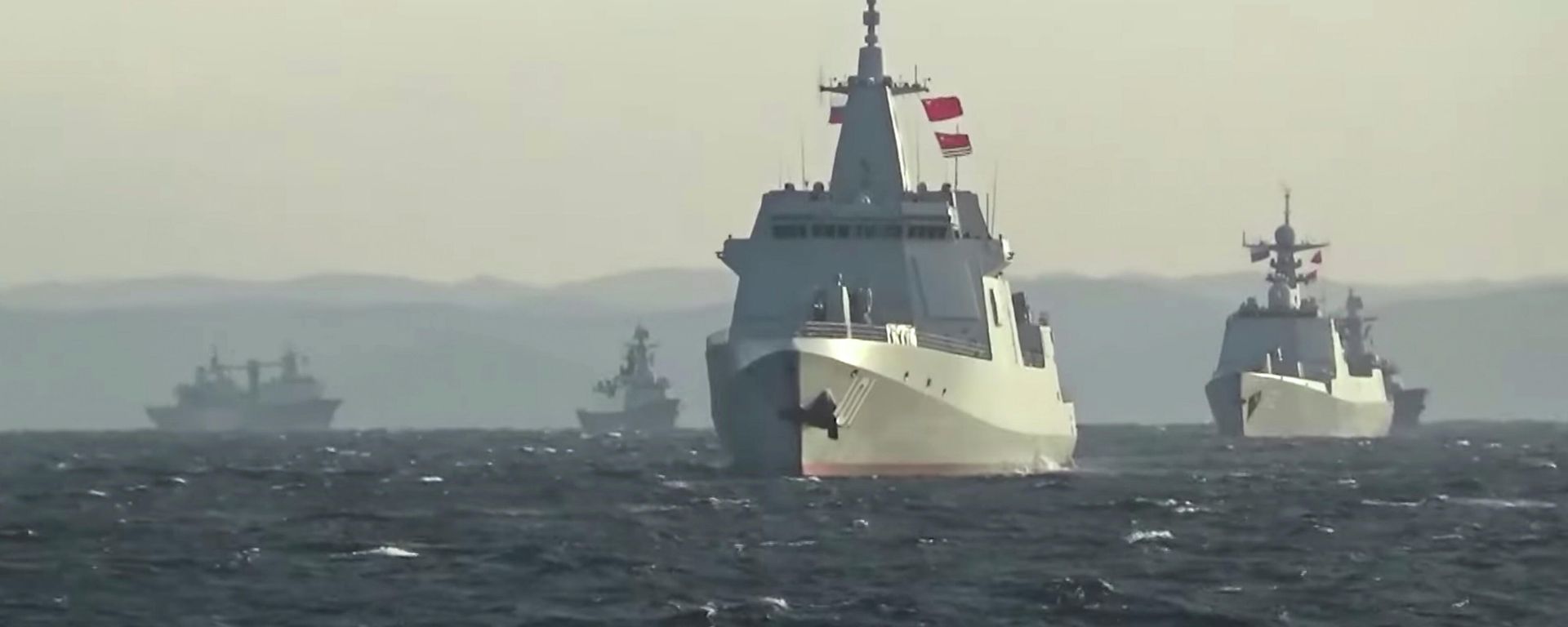 A group of naval vessels from China and Russia sails during joint military drills in the Sea of Japan, in this still image taken from video released on October 18, 2021. Video released October 18, 2021 A group of naval vessels from China and Russia sails during joint military drills in the Sea of Japan, in this still image taken from video released on October 18, 2021. Video released October 18, 2021 - Sputnik International, 1920, 25.10.2021