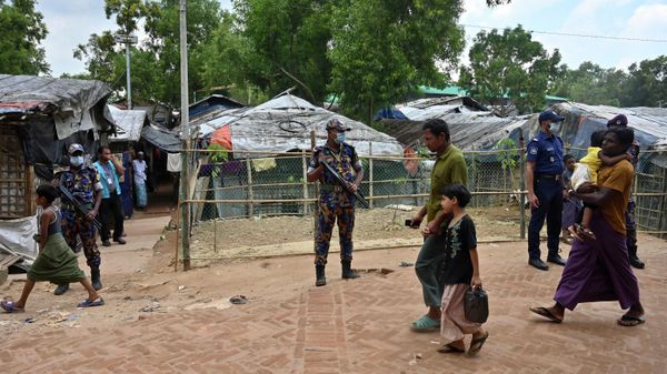 Law enforcement officials stand guard near the office of slain community Rohingya leader Mohib Ullah, who was shoot dead by gunmen last month, at Kutupalong refugee camp in Ukhia on October 6, 2021 - Sputnik International