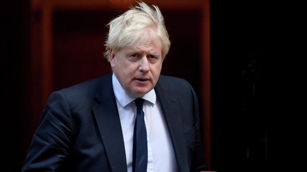 Britain's Prime Minister Boris Johnson walks outside Downing Street in London, Britain October 20, 2021.  - Sputnik International