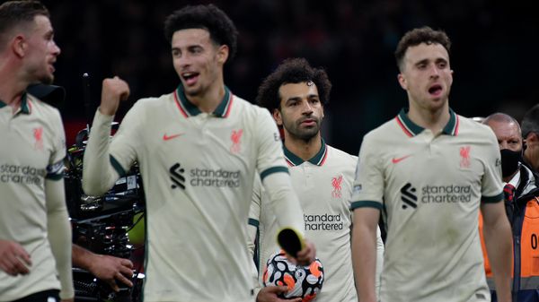 Liverpool's Mohamed Salah, background center, leaves the field with the match ball at the end of the English Premier League soccer match between Manchester United and Liverpool at Old Trafford in Manchester, England, Sunday, Oct. 24, 2021. Liverpool's Mohamed Salah, background center, leaves the field with the match ball at the end of the English Premier League soccer match between Manchester United and Liverpool at Old Trafford in Manchester, England, Sunday, Oct. 24, 2021. - Sputnik International