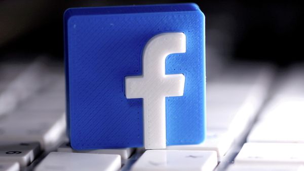 A 3D-printed Facebook logo is seen placed on a keyboard in this illustration taken March 25, 2020.  - Sputnik International