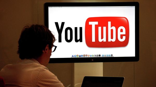 FILE PHOTO: A visitor is seen at the YouTube stand during the annual MIPCOM television programme market in Cannes - Sputnik International