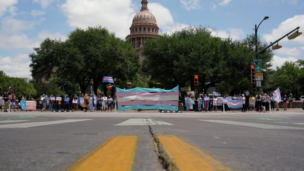 Demonstrators gather on the steps to the State Capitol to speak against transgender related legislation bills being considered in the Texas Senate and Texas House, Thursday, May 20, 2021, in Austin, Texas. - Sputnik International