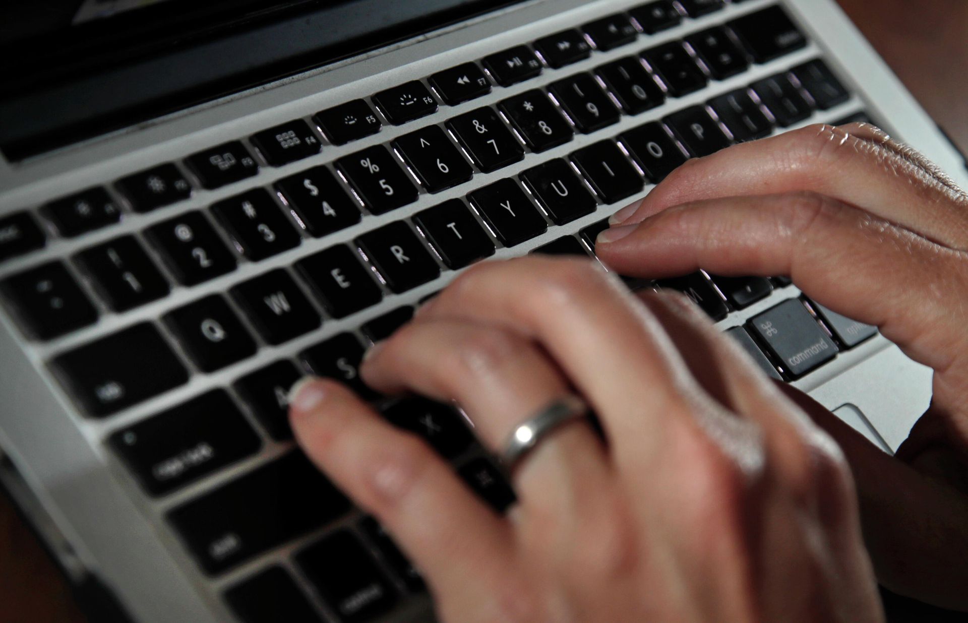 In this June 19, 2017, file photo, a person types on a laptop keyboard in North Andover, Mass. - Sputnik International, 1920, 08.07.2022