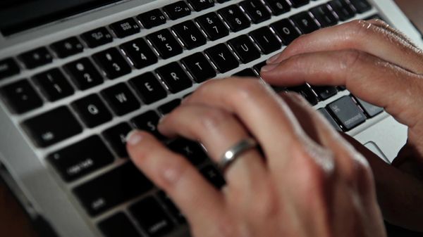 In this June 19, 2017, file photo, a person types on a laptop keyboard in North Andover, Mass. - Sputnik International