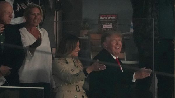 Oct 30, 2021; Atlanta, Georgia, USA; Former President Donald Trump and First Lady Melania Trump do the Tomahawk Chop prior to game four of the 2021 World Series between the Atlanta Braves and the Houston Astros at Truist Park. - Sputnik International