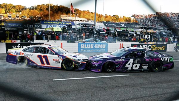 Denny Hamlin (11) prevents Alex Bowman (48) from doing a celebratory burnout after a NASCAR Cup Series auto race, Sunday, Oct. 31, 2021, in Martinsville, Va. - Sputnik International