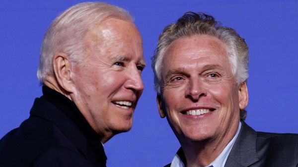 U.S. President Joe Biden and Democratic candidate for governor of Virginia Terry McAuliffe smile onstage at a rally in Arlington, Virginia, U.S. October 26, 2021.  - Sputnik International