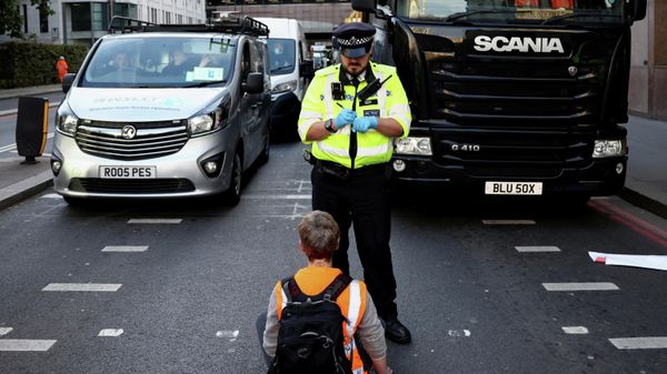 FILE PHOTO: An Insulate Britain activist blocks a road in front of a police officer during a protest in London, Britain October 25, 2021. REUTERS/Henry Nicholls/File Photo - Sputnik International