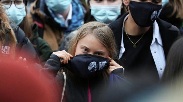 Swedish activist Greta Thunberg adjusts her mask at the Festival Park as the UN Climate Change Conference (COP26) takes place in Glasgow, Scotland, Britain, November 1, 2021 - Sputnik International