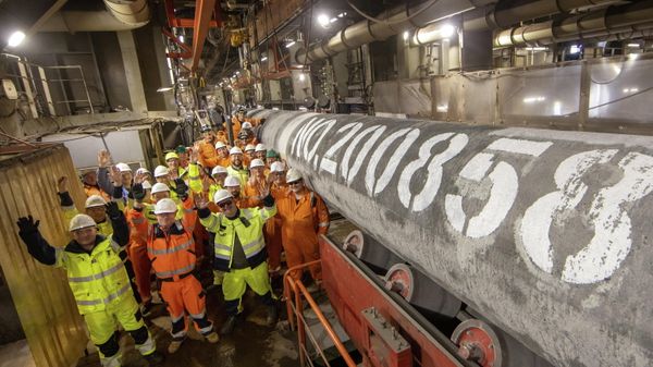 Specialists pose for a picture after welding the last pipe of the Nord Stream 2 gas subsea pipeline onboard the laybarge Fortuna in German waters in the Baltic Sea, September 6, 2021 - Sputnik International