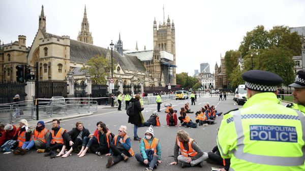 Insulate Britain activists have their hands and feet glued to the road as they block a road outside the Houses of Parliament during a protest in London, Britain on 4 November 2021. - Sputnik International