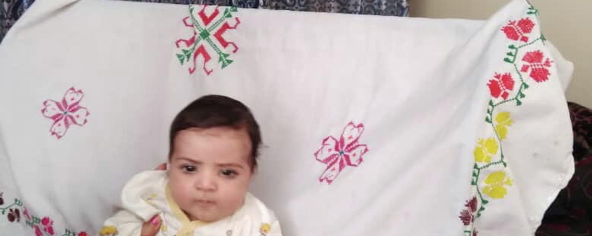 Sohail Ahmadi, around two-months-old, is seen in this handout picture taken August 2021 in Kabul, Afghanistan. Sohail's parents Mirza Ali and his wife Suraya handed him over the fence to a U.S. soldier on August 19, 2021 in the chaos following the U.S. troop withdrawal and hasty evacuation at the Kabul Airport. But by the time the family got to the other side of the fence, the baby was no where to be found. Sohail Ahmadi, around two-months-old, is seen in this handout picture taken August 2021 in Kabul, Afghanistan. Sohail's parents Mirza Ali and his wife Suraya handed him over the fence to a U.S. soldier on August 19, 2021 in the chaos following the U.S. troop withdrawal and hasty evacuation at the Kabul Airport. But by the time the family got to the other side of the fence, the baby was no where to be found. - Sputnik International, 1920, 06.11.2021
