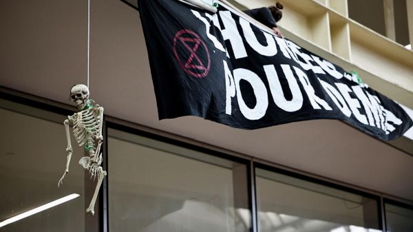 A hanging skeleton is seen during a protest organised by Extinction Rebellion to denounce the lack of measures against climate change ahead of COP26 summit in front of the Westfield Forum des Halles shopping centre, in Paris, France, October 31, 2021 - Sputnik International