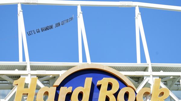 A plane tows a sign with the phrase Let's go Brandon” over the stadium prior to the game between the Miami Dolphins and the Houston Texans at Hard Rock Stadium. - Sputnik International