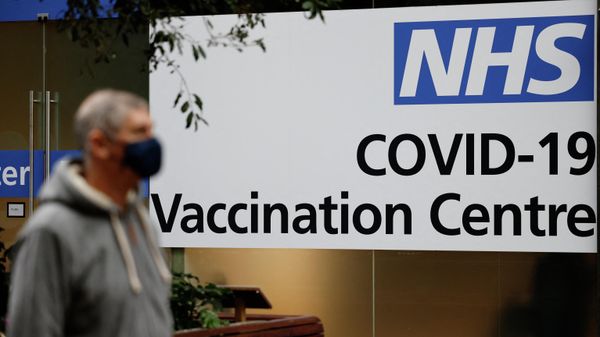 People queue to enter an NHS Covid-19 vaccination centre in Westfield Stratford City shopping centre in east London on February 15, 2021 as Britain's largest ever vaccination programme continues - Sputnik International