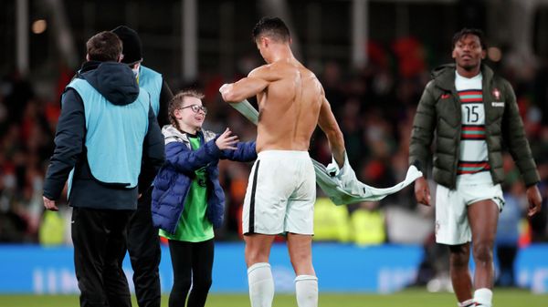 Portugal's Cristiano Ronaldo gives his shirt to a young fan who walked on to the pitch at the end of the World Cup 2022 group A qualifying soccer match between the Republic of Ireland and Portugal at the Aviva stadium in Dublin, Thursday, Nov. 11, 2021 Portugal's Cristiano Ronaldo gives his shirt to a young fan who walked on to the pitch at the end of the World Cup 2022 group A qualifying soccer match between the Republic of Ireland and Portugal at the Aviva stadium in Dublin, Thursday, Nov. 11, 2021 - Sputnik International