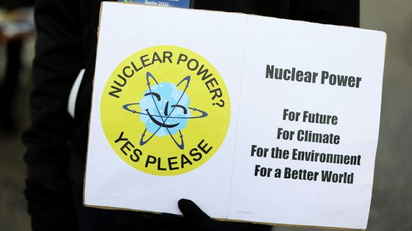 An activist holds a placard during a protest against the closure of the last six German nuclear power plants, in Berlin, Germany, November 13, 2021 - Sputnik International