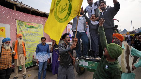 Farmers shout slogans as they celebrate news of the repeal of farm laws they were protesting against, in Singhu, on the outskirts of New Delhi, India, Friday, Nov. 19, 2021. In a surprise announcement, India's Prime Minister Narendra Modi said Friday his government will withdraw the controversial agriculture laws that prompted yearlong protests from tens of thousands of farmers and posed a significant political challenge to his administration. - Sputnik International