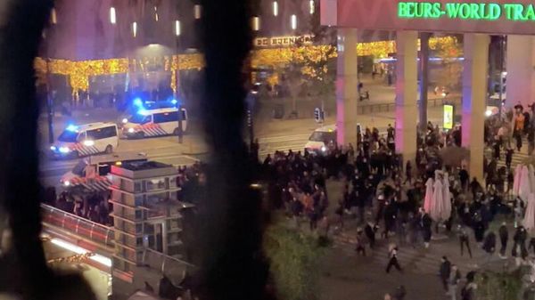 Police vehicles are seen near protesters during demonstrations against coronavirus disease (COVID-19) measures which turned violent in Rotterdam, Netherlands, November 19, 2021, in this still image obtained from video provided on social media.  - Sputnik International