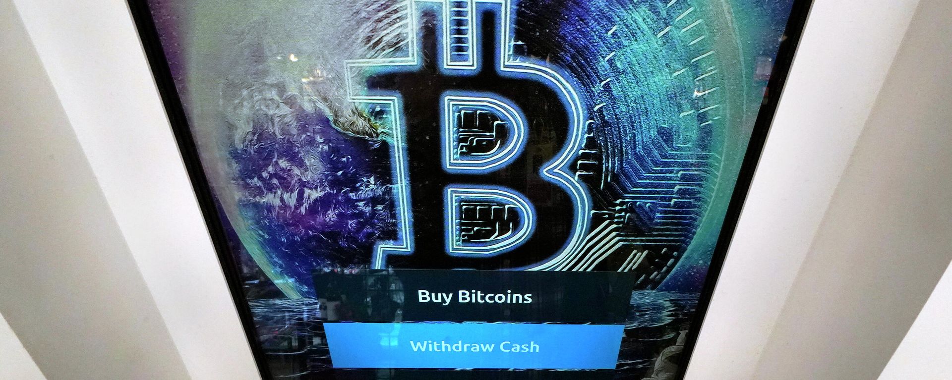 In this Feb. 9, 2021, file photo, the Bitcoin logo appears on the display screen of a cryptocurrency ATM in Salem, N.H. In this Feb. 9, 2021, file photo, the Bitcoin logo appears on the display screen of a cryptocurrency ATM in Salem, N.H. - Sputnik International, 1920, 21.11.2021
