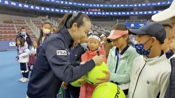Chinese tennis player Peng Shuai signs large-sized tennis balls at the opening ceremony of Fila Kids Junior Tennis Challenger Final in Beijing, China November 21, 2021, in this screen grab obtained from a social media video. TWITTER @QINGQINGPARIS via REUTERS THIS IMAGE HAS BEEN SUPPLIED BY A THIRD PARTY. MANDATORY CREDIT. NO RESALES. NO ARCHIVES. - Sputnik International