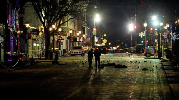 Police inspect the crime scene after a car plowed through a holiday parade in Waukesha, Wisconsin, U.S., November 22, 2021 - Sputnik International