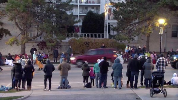 A red SUV speeds past attendees moments before plowing into a crowd at a Christmas parade in Waukesha, Wisconsin, U.S., in this still image taken from a November 21, 2021 social media video. - Sputnik International