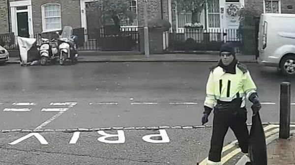 A man wearing a latex mask and posing as a litter picker, who the prosecution claim was Anis Hemissi - Sputnik International