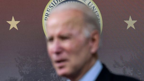 The presidential seal is seen as U.S. President Joe Biden delivers remarks on the economy and lowering prices during a speech in the Eisenhower Executive Office Building’s South Court Auditorium at the White House in Washington, U.S., November 23, 2021. - Sputnik International