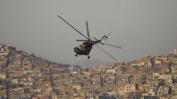 A military helicopter is pictured during the Taliban military parade in Kabul, Afghanistan November 14, 2021. - Sputnik International