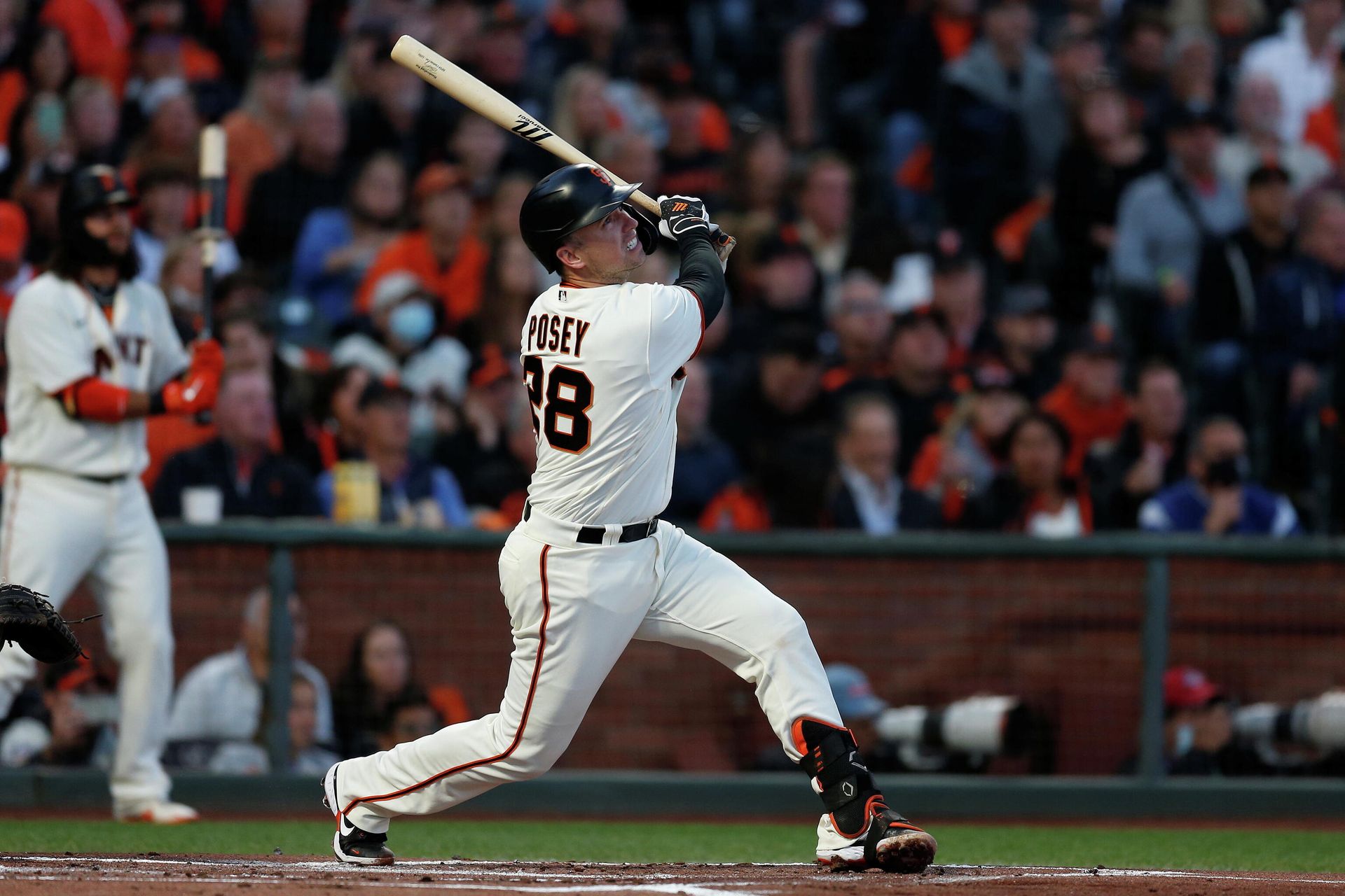 Oct 14, 2021; San Francisco, California, USA; San Francisco Giants catcher Buster Posey (28) hits a double against the Los Angeles Dodgers in the first inning during game five of the 2021 NLDS at Oracle Park. Oct 14, 2021; San Francisco, California, USA; San Francisco Giants catcher Buster Posey (28) hits a double against the Los Angeles Dodgers in the first inning during game five of the 2021 NLDS at Oracle Park. - Sputnik International, 1920, 02.12.2021