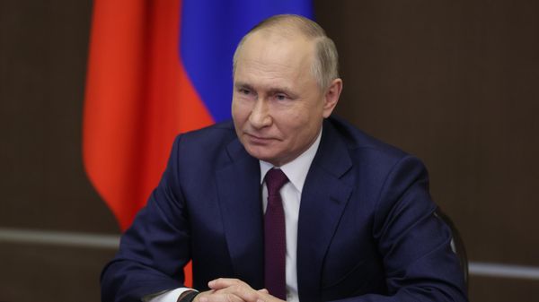 Vladimir Putin during a meeting with the president of the International Federation of Red Cross and Red Crescent Societies (IFRC), Francesco Rocca - Sputnik International