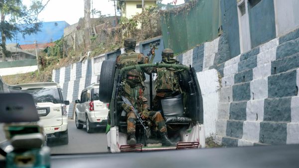 Indian army soldiers ride past the main town in a convoy in Kohima, capital of northeastern Nagaland state, India, Sunday, Dec. 5, 2021 - Sputnik International