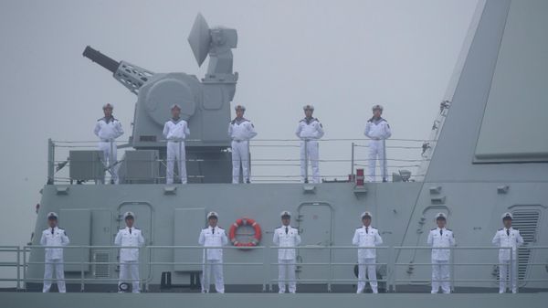 Sailors stand on the deck of the new type 055 guided-missile destroyer Nanchang of the Chinese People's Liberation Army (PLA) Navy as it participates in a naval parade to commemorate the 70th anniversary of the founding of China's PLA Navy in the sea near Qingdao in eastern China's Shandong province, Tuesday, April 23, 2019 - Sputnik International